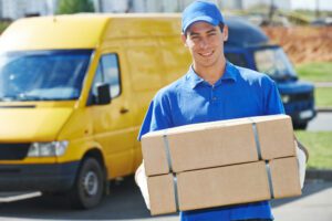 A man and his delivery truck. After a collision, you can work with a Riverside delivery truck accident lawyer.