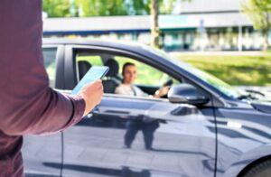 A man preparing for an Uber ride. You may work with a Riverside Uber accident lawyer if your trip results in a collision.